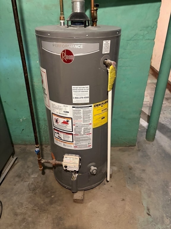 utility room featuring gas water heater