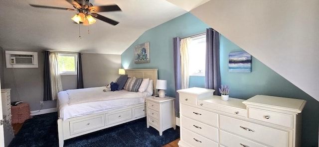 bedroom featuring a wall unit AC, lofted ceiling, and a ceiling fan