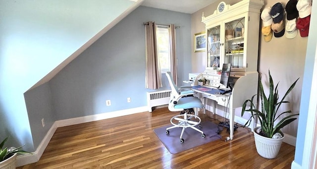 office with radiator heating unit, wood finished floors, and baseboards