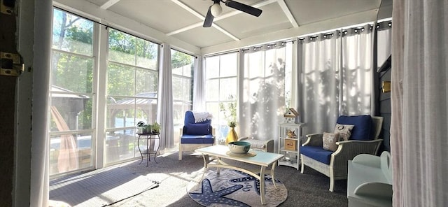 sunroom featuring a ceiling fan