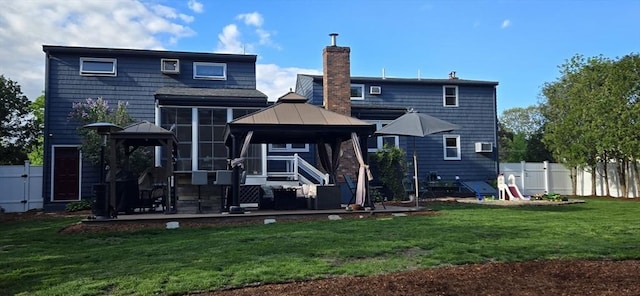 back of house featuring a gazebo, a chimney, and a patio