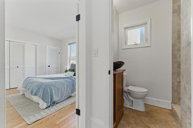 bedroom featuring baseboards