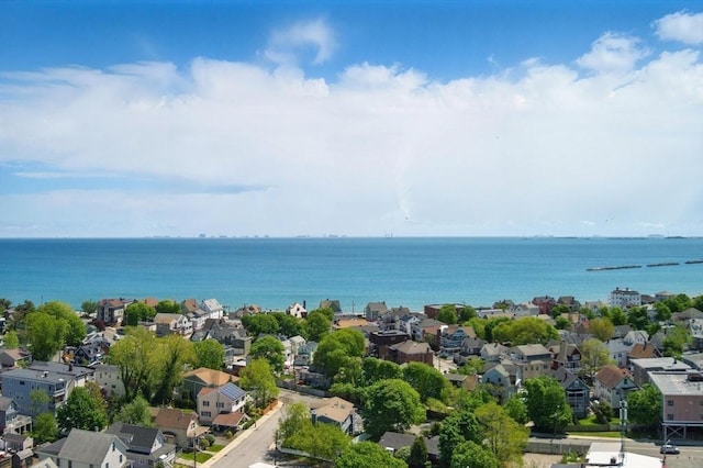aerial perspective of suburban area featuring a nearby body of water