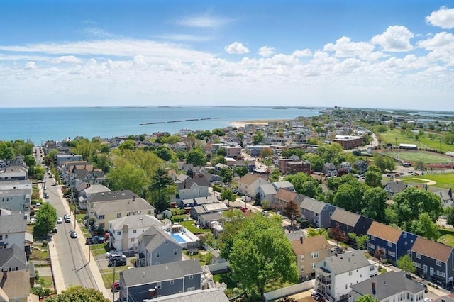 aerial view of residential area with a large body of water