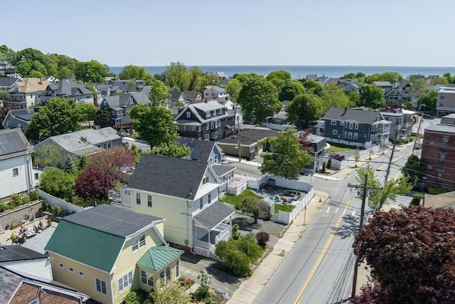 aerial perspective of suburban area featuring a nearby body of water