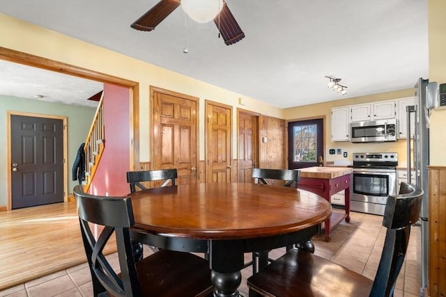 dining area featuring ceiling fan and light tile patterned floors