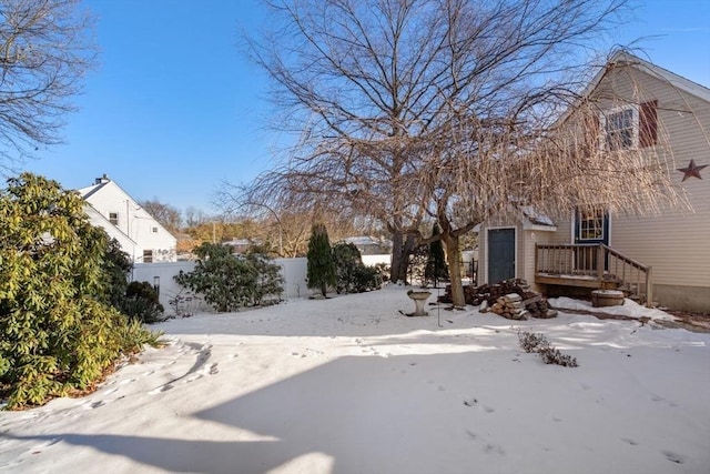 view of yard layered in snow