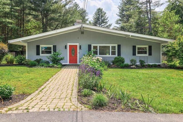 128 Clinton St, Hopkinton, MA 01748 - view of front of home with a front lawn