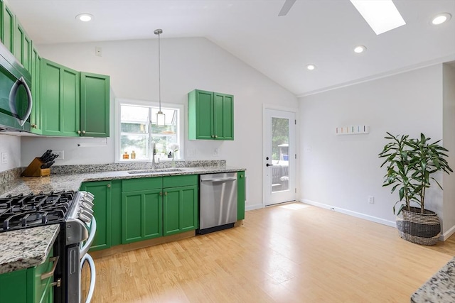 128 Clinton St, Hopkinton, MA 01748 - kitchen with appliances with stainless steel finishes, lofted ceiling, green cabinets, a sink, and light wood-style flooring