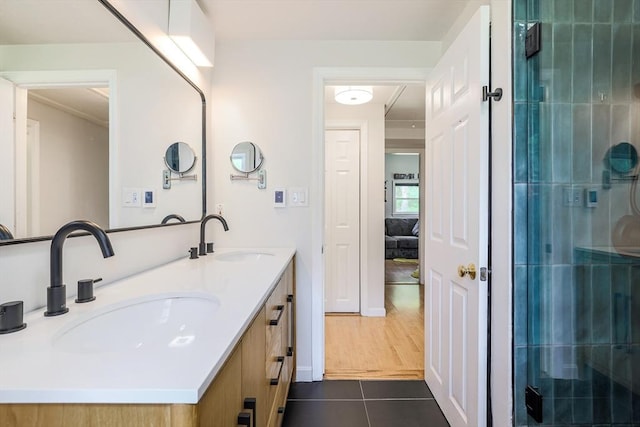 128 Clinton St, Hopkinton, MA 01748 - full bath with tile patterned floors, double vanity, and an enclosed shower
