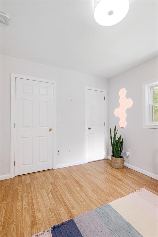128 Clinton St, Hopkinton, MA 01748 - interior space with light wood-style flooring and baseboards