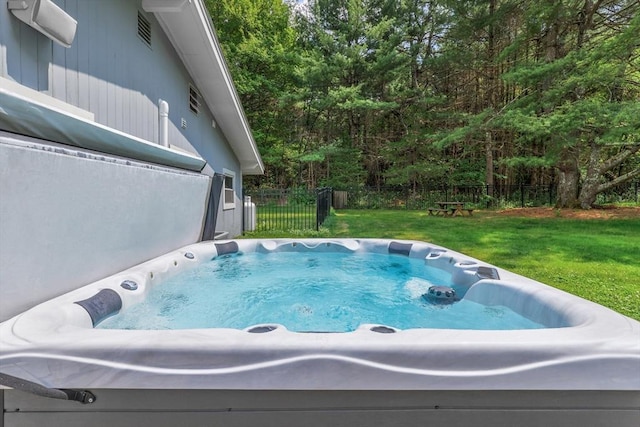 128 Clinton St, Hopkinton, MA 01748 - view of swimming pool featuring a hot tub and a wooded view