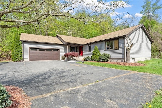 25 Williams Rd, Fitchburg, MA 01420 - ranch-style house featuring driveway, a garage, and roof with shingles