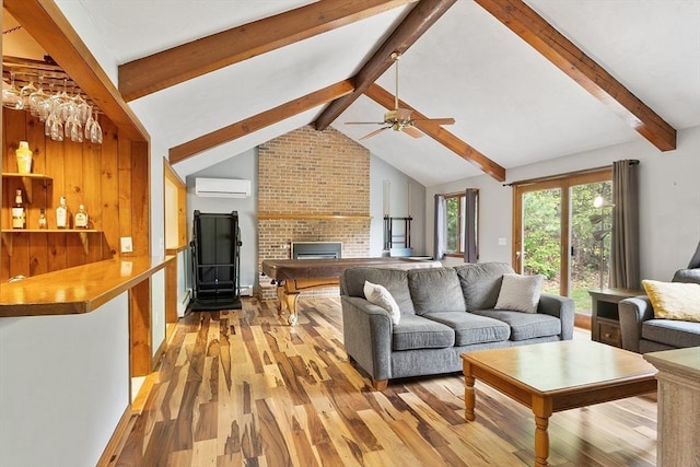 25 Williams Rd, Fitchburg, MA 01420 - living area with light wood finished floors, a wall mounted air conditioner, a brick fireplace, and ceiling fan