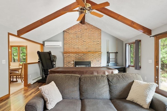 25 Williams Rd, Fitchburg, MA 01420 - living room featuring a baseboard heating unit, wood finished floors, an AC wall unit, a fireplace, and a ceiling fan
