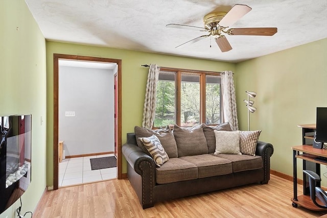 25 Williams Rd, Fitchburg, MA 01420 - living room featuring a ceiling fan, baseboards, and wood finished floors