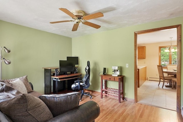 25 Williams Rd, Fitchburg, MA 01420 - office area featuring a baseboard radiator, a ceiling fan, a chandelier, light wood-type flooring, and baseboards