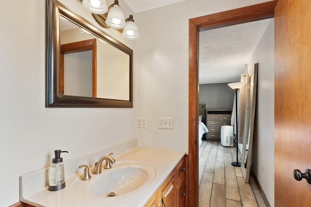 25 Williams Rd, Fitchburg, MA 01420 - bathroom with vanity, ensuite bathroom, and wood finished floors