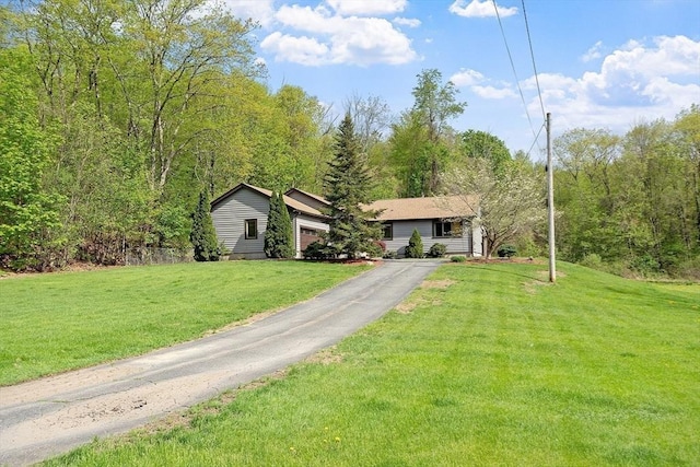 25 Williams Rd, Fitchburg, MA 01420 - ranch-style home featuring a front yard and driveway