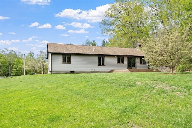 25 Williams Rd, Fitchburg, MA 01420 - back of property with a yard and a chimney