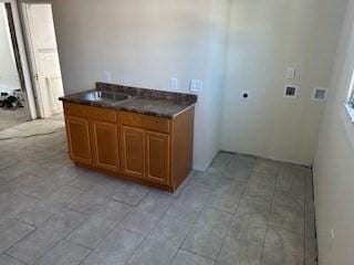 interior space featuring dark countertops and brown cabinets