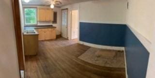 kitchen with light brown cabinets and wood finished floors