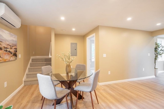 22 Mountain Brook Rd, Sturbridge, MA 01566 - dining room featuring a wall mounted AC, electric panel, light wood-style floors, recessed lighting, and stairs