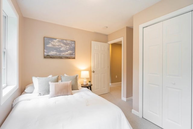 22 Mountain Brook Rd, Sturbridge, MA 01566 - bedroom featuring a closet, light colored carpet, and baseboards