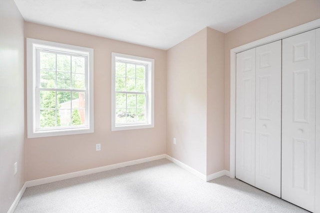 22 Mountain Brook Rd, Sturbridge, MA 01566 - unfurnished bedroom featuring baseboards, light colored carpet, and a closet