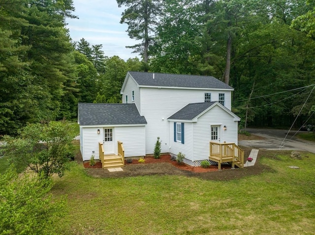 22 Mountain Brook Rd, Sturbridge, MA 01566 - back of property with a shingled roof, a yard, and a forest view