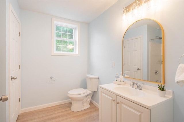 22 Mountain Brook Rd, Sturbridge, MA 01566 - full bathroom featuring wood finished floors, vanity, toilet, baseboards, and a shower