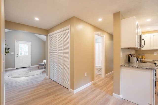 22 Mountain Brook Rd, Sturbridge, MA 01566 - kitchen featuring white cabinets, light wood-type flooring, light stone counters, stainless steel microwave, and recessed lighting