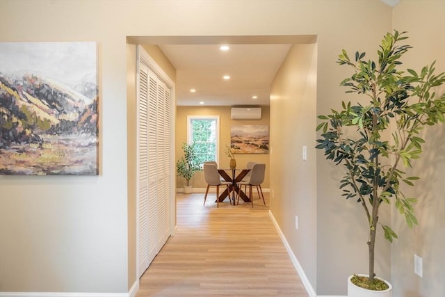 22 Mountain Brook Rd, Sturbridge, MA 01566 - corridor with light wood-style floors, recessed lighting, a wall mounted air conditioner, and baseboards