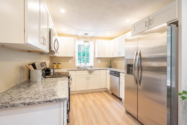 22 Mountain Brook Rd, Sturbridge, MA 01566 - kitchen with appliances with stainless steel finishes, light wood finished floors, recessed lighting, white cabinets, and light stone countertops
