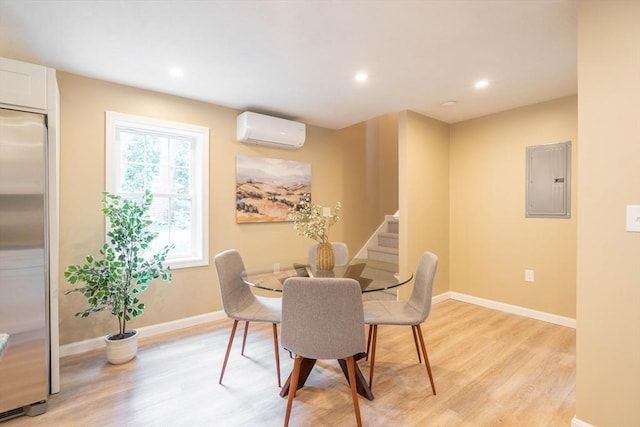 22 Mountain Brook Rd, Sturbridge, MA 01566 - dining room with a wall mounted AC, electric panel, light wood finished floors, stairs, and recessed lighting