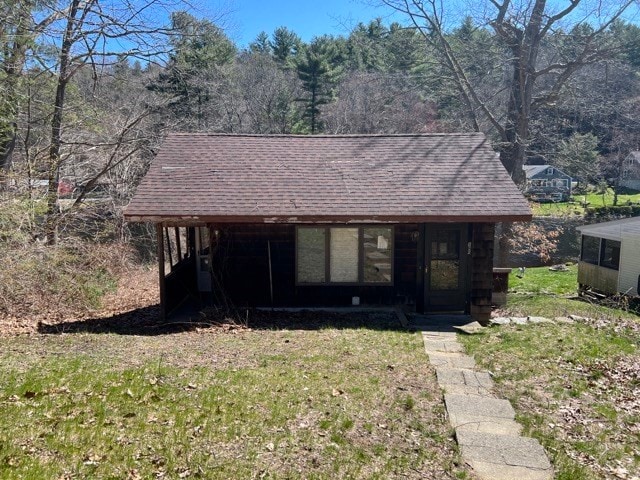 view of front of home with a front yard