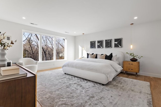 bedroom with wood-type flooring