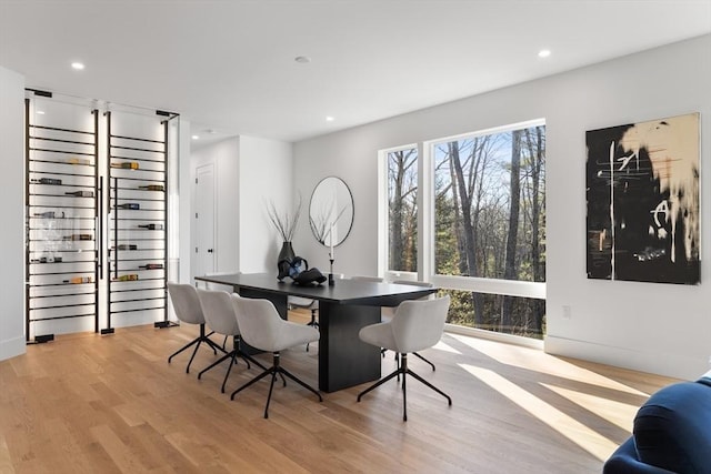 dining area with light hardwood / wood-style flooring