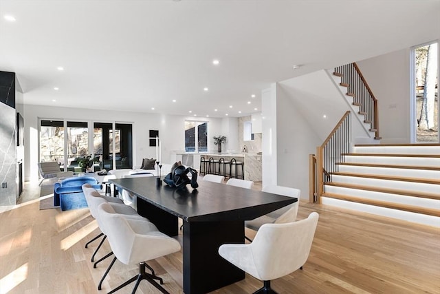 dining space featuring light hardwood / wood-style floors and plenty of natural light