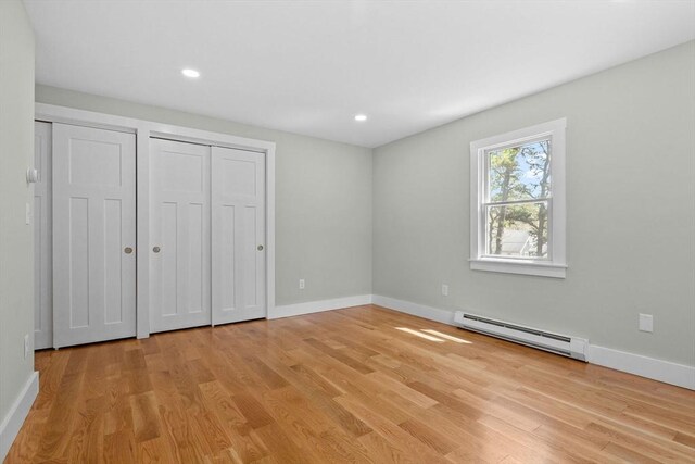 30 Grannys Ln, Orleans, MA 02653 - unfurnished bedroom featuring a baseboard radiator, light wood-style floors, recessed lighting, and baseboards