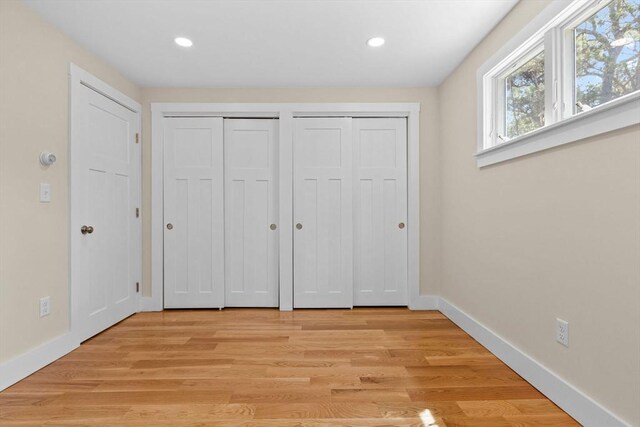 30 Grannys Ln, Orleans, MA 02653 - unfurnished bedroom with light wood-type flooring, multiple closets, and recessed lighting