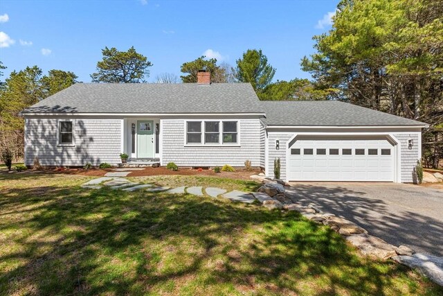30 Grannys Ln, Orleans, MA 02653 - single story home with a chimney, a garage, driveway, roof with shingles, and a front lawn