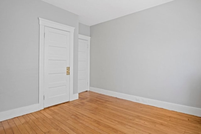 unfurnished room featuring light hardwood / wood-style floors