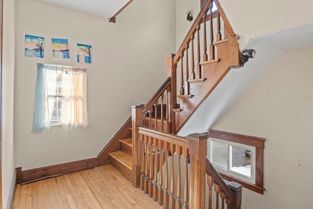 stairs with wood-type flooring