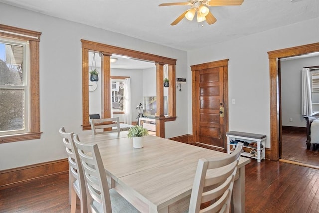 dining room featuring dark wood-type flooring and ceiling fan