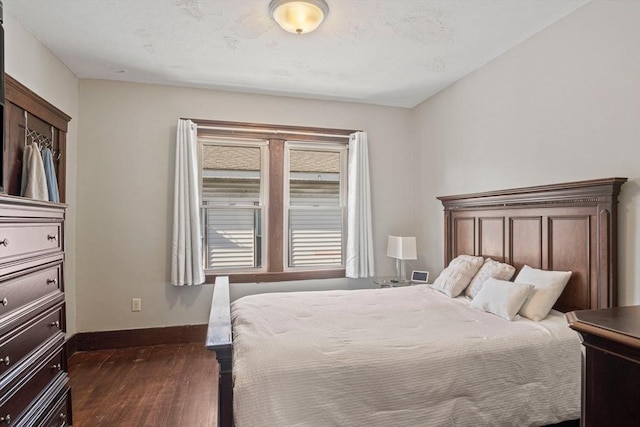 bedroom featuring dark wood-type flooring