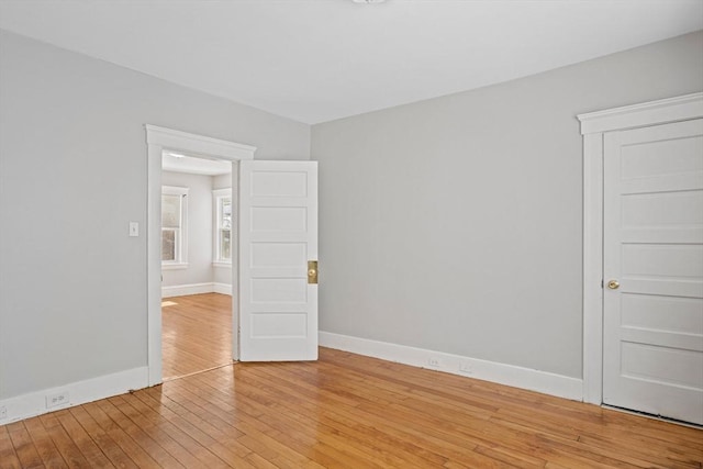 spare room featuring light hardwood / wood-style floors