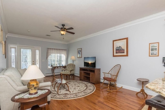 living room featuring crown molding, ceiling fan, wood-type flooring, and baseboard heating