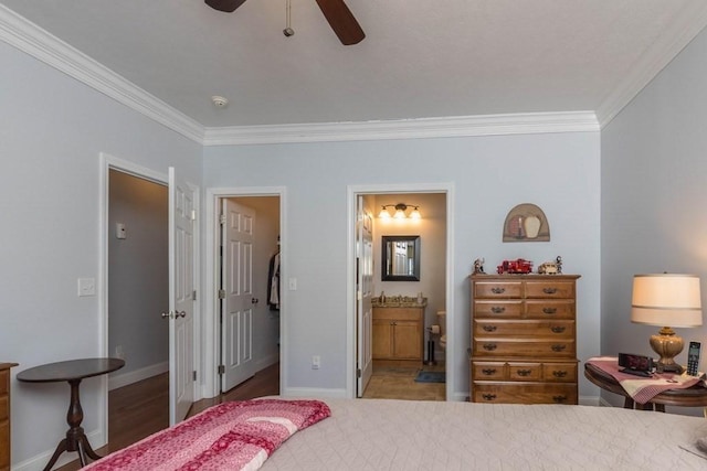 bedroom with crown molding, ensuite bath, and ceiling fan