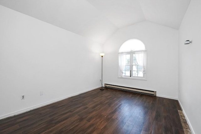 empty room featuring dark wood-type flooring, a baseboard radiator, and vaulted ceiling